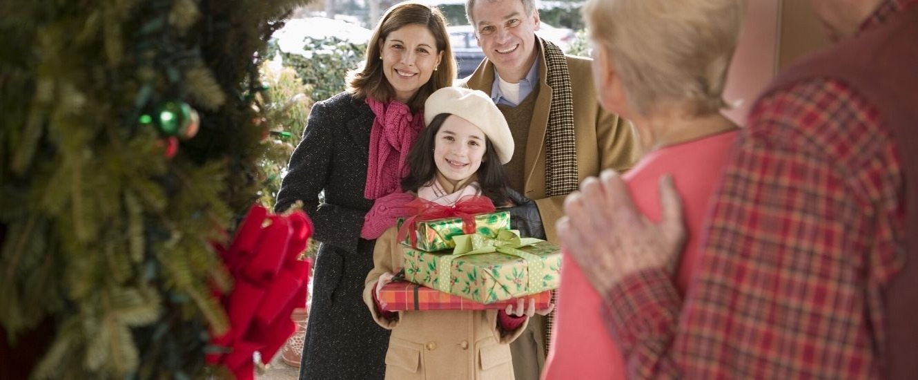 Man, woman and daughter visiting grandparents for Christmas